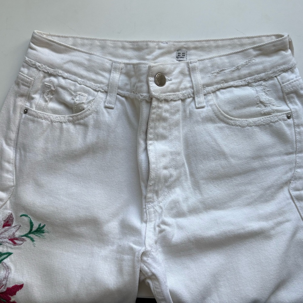 White denim with floral embroidery on side